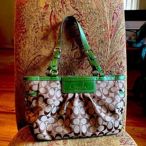 Signature Coach bag with light green accents!